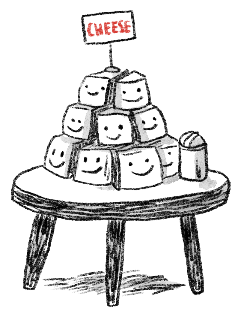 A pyramid of cheese wedges on a table